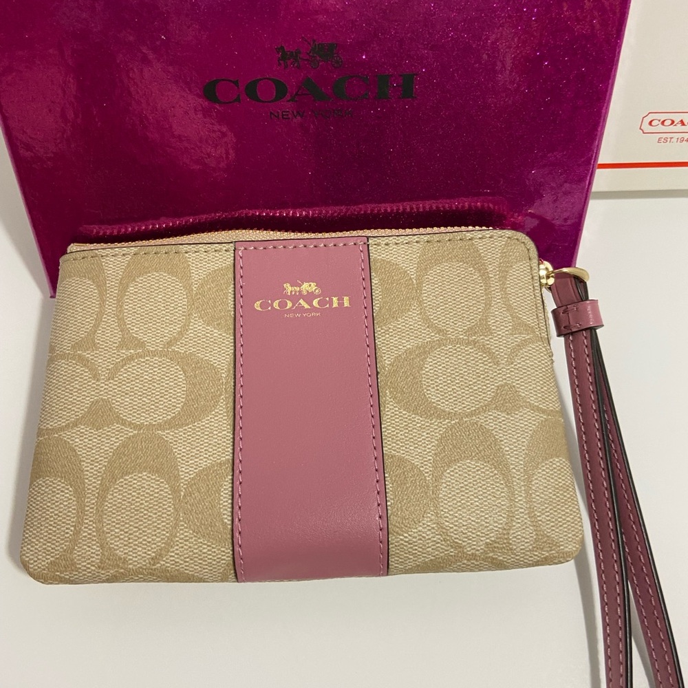 COACH WRISTLET WITH C-SIGNATURE COACH ON IT AND WITH A PINK STRIPE ON FRONT. - Picture 3 of 8